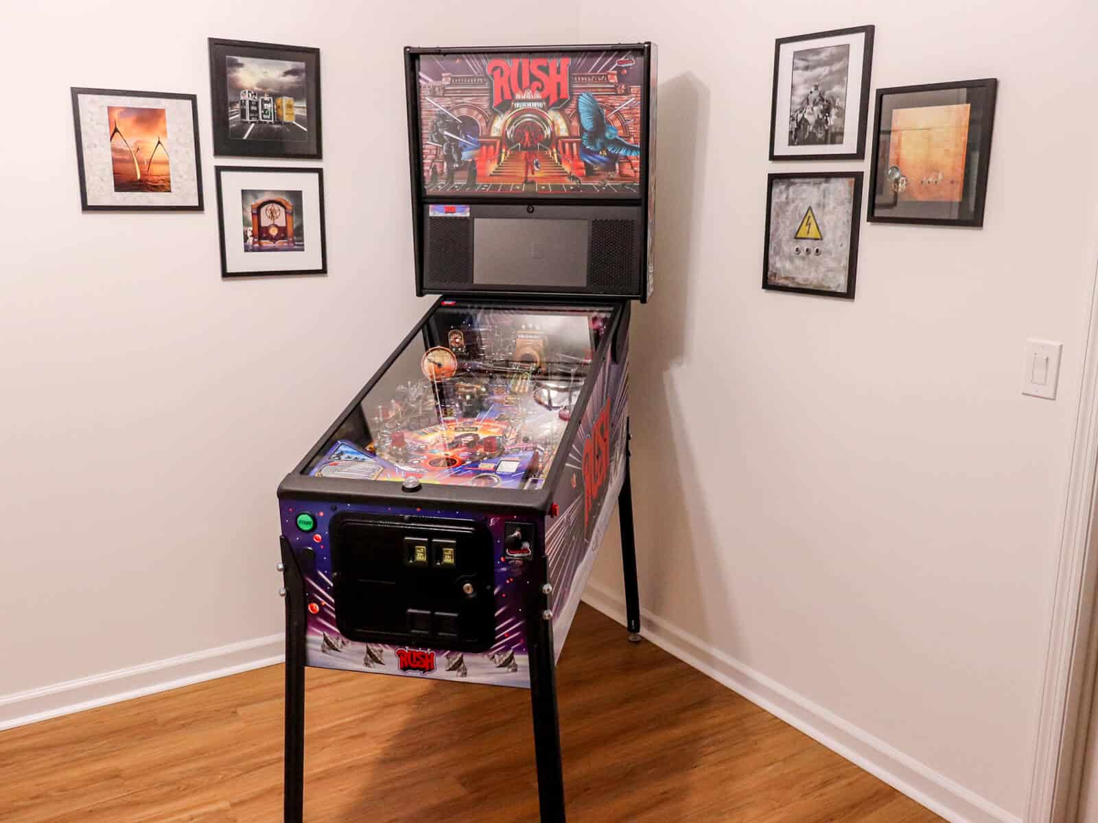 Rush pinball machine by Stern in a basement room