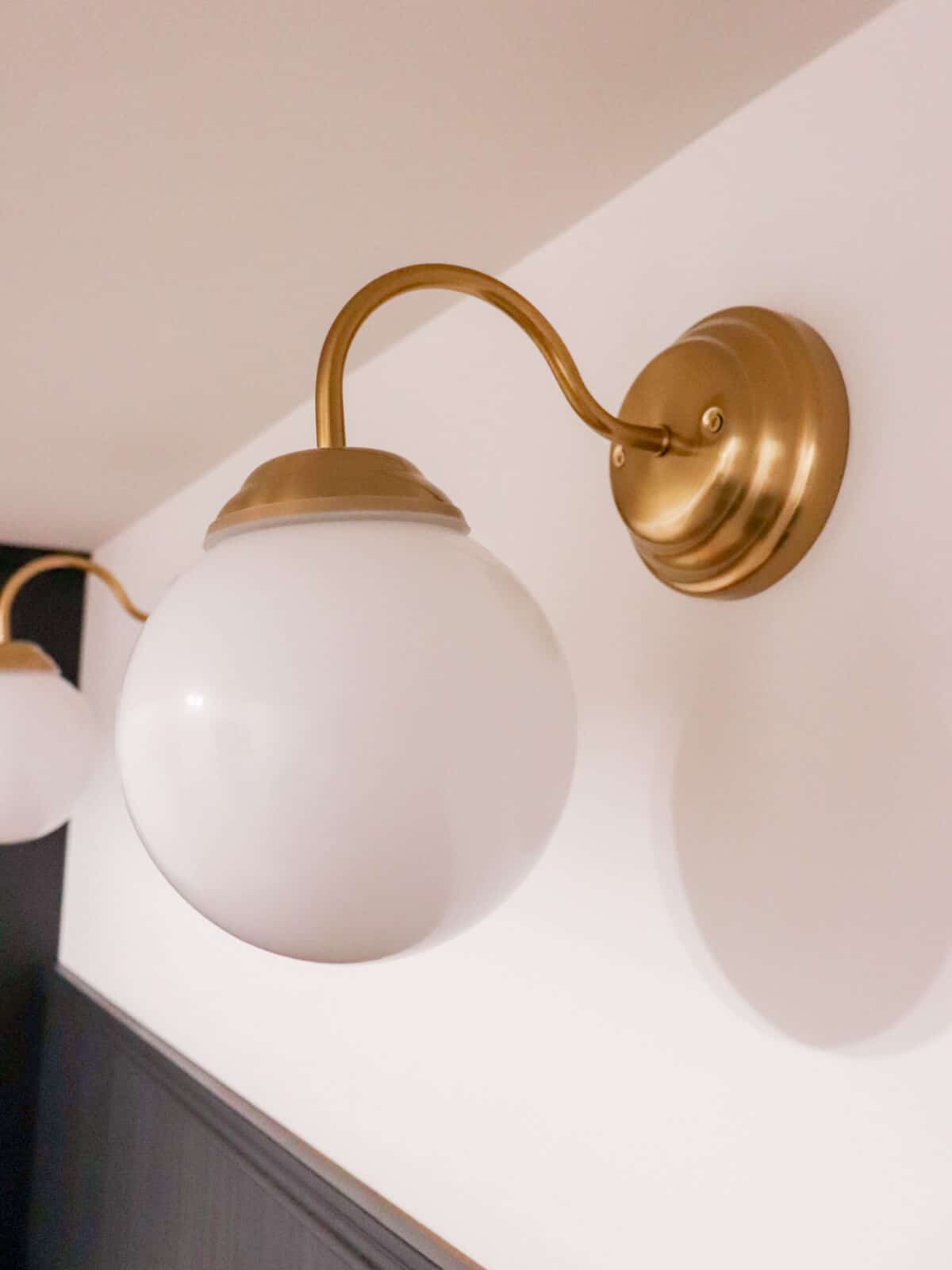 brass harp lights with white globes