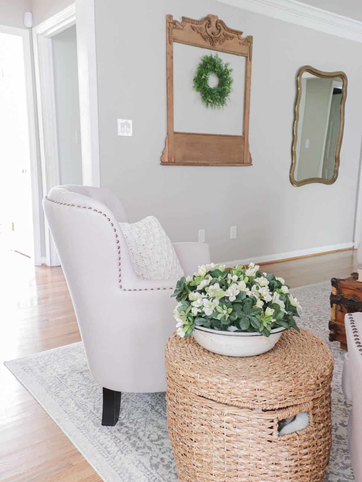 living room styled for summer with whites, wood grains and grays