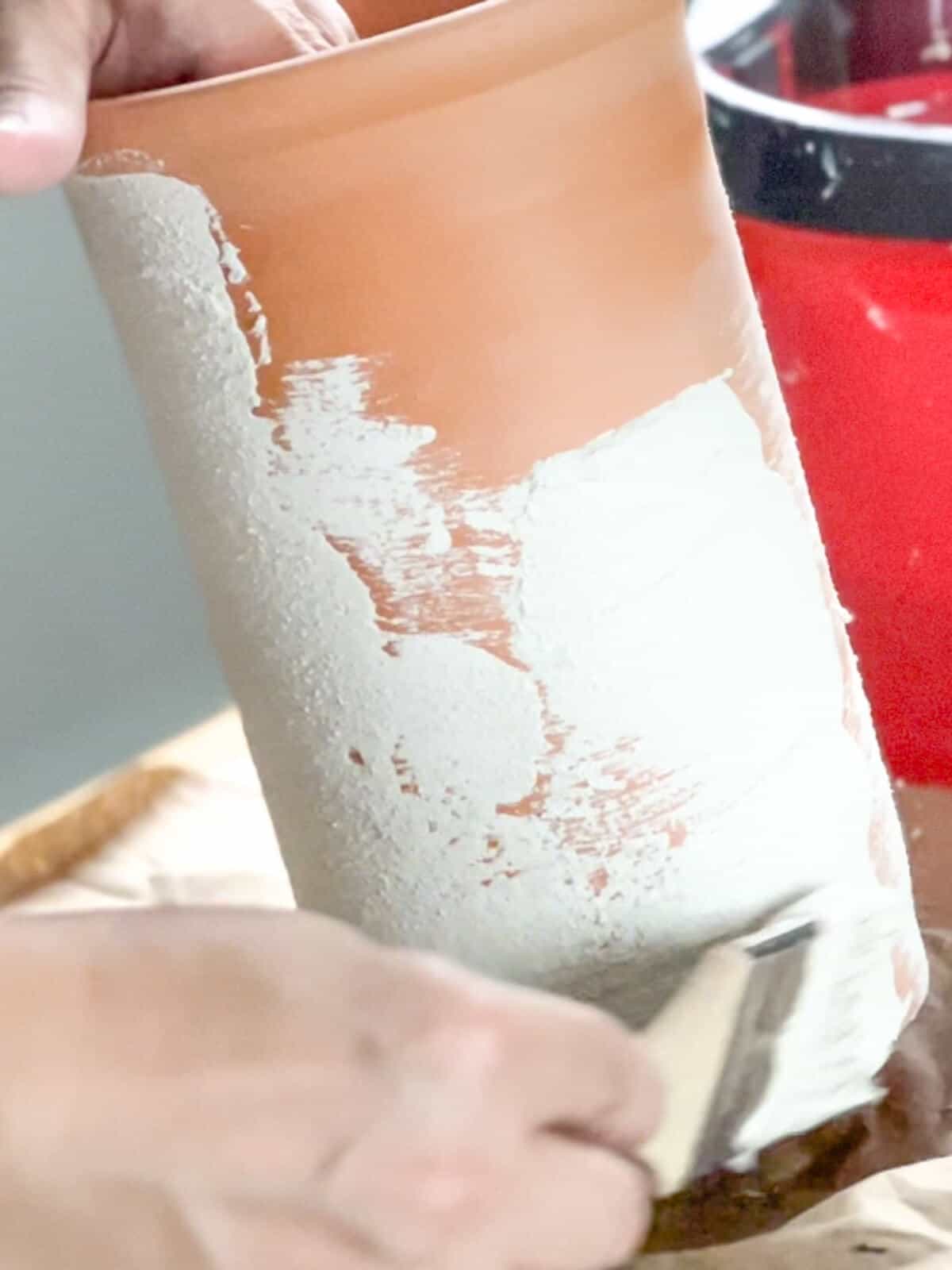 painting a terracotta vase with romabio lime slurry