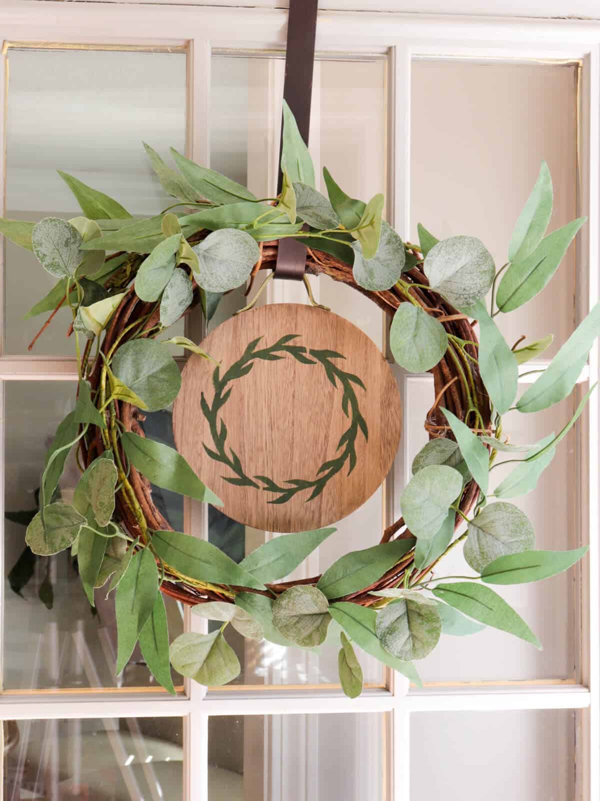 door wreath with an easy seasonal interchangeable disc with a stencil