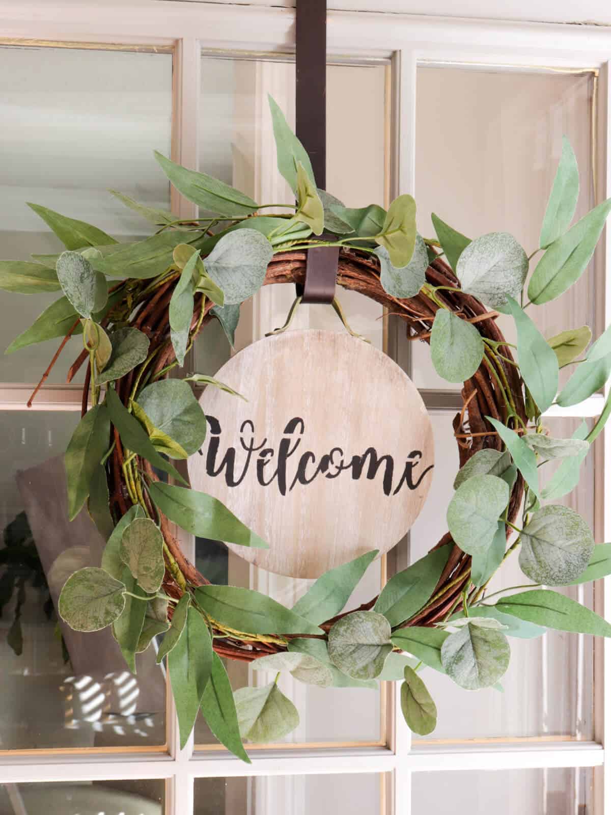 door wreath with an easy seasonal interchangeable disc with a welcome stencil