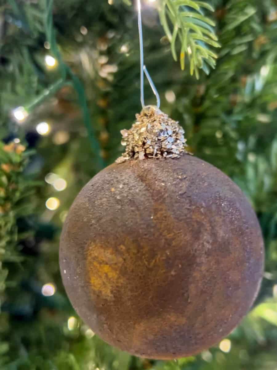 diy rust covered ornament with gold glitter