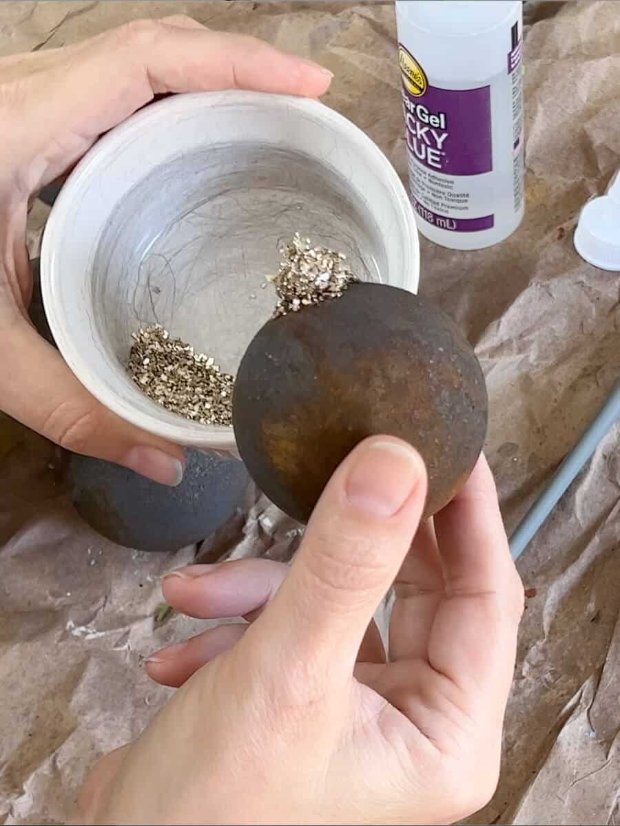 diy rust ornament with glitter on top