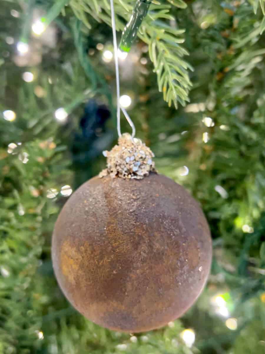 diy ornament with rust finish and glitter on top