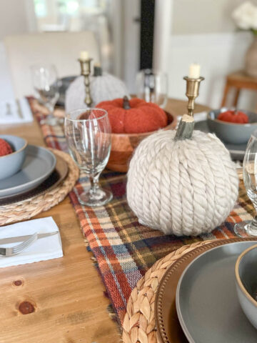 simple table setting for thanksgiving with knits, plaids and gray plates