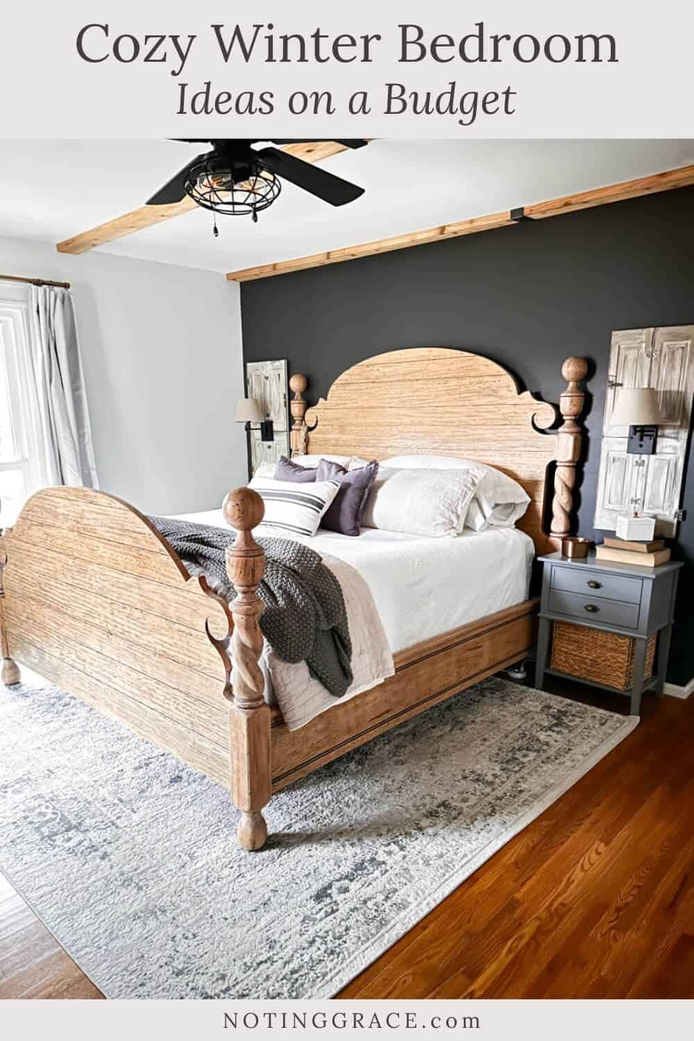 four poster cannonball bed against a black wall with white, beige and charcoal bedding