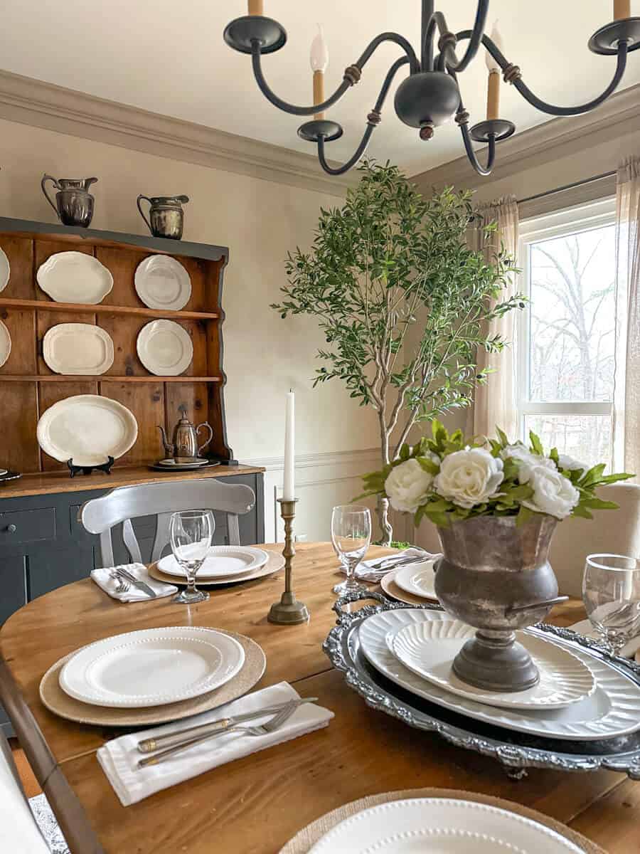 Farmhouse Dining table with white plates and burlap covered chargers