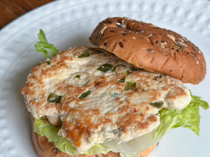 Feta Chicken Burger on a bun on a plate
