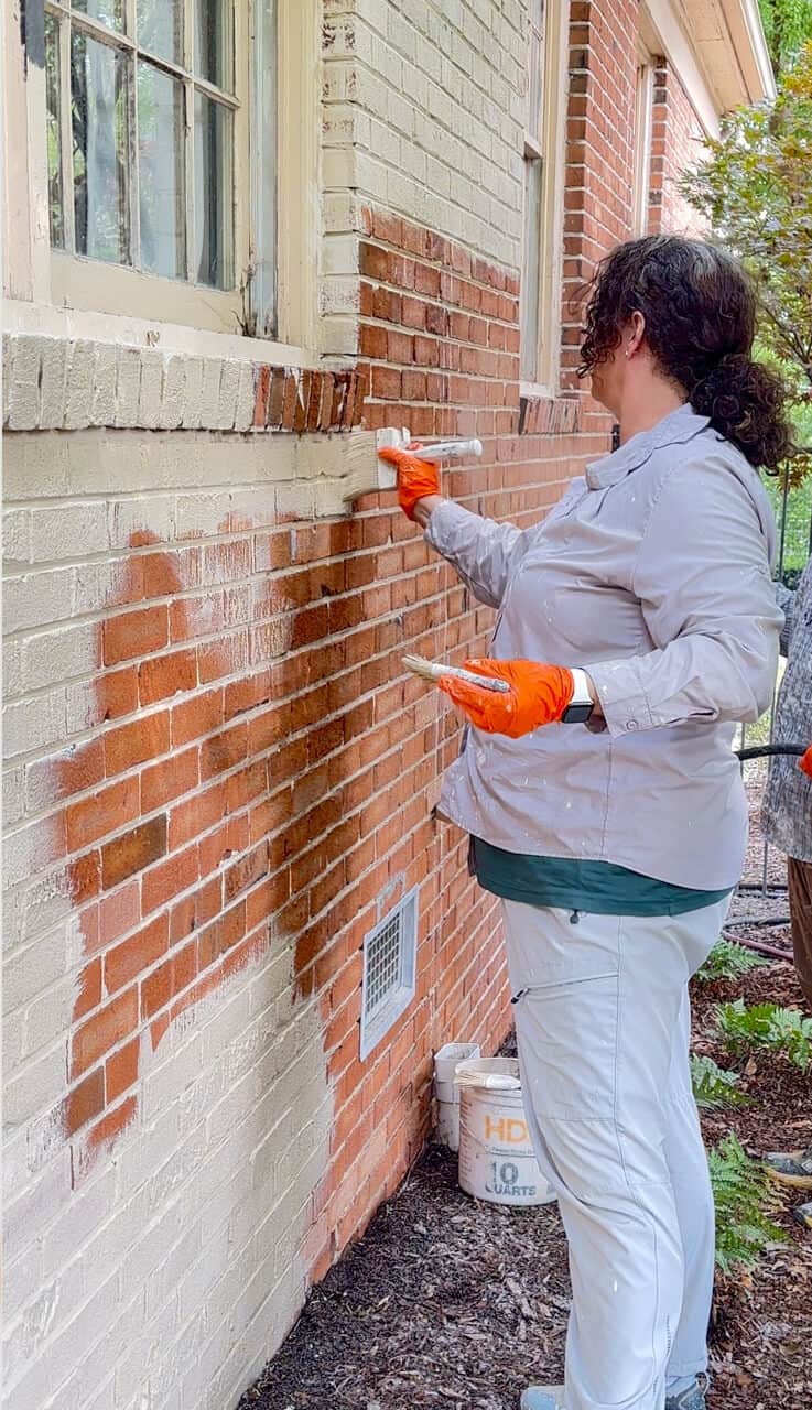 painting 1950s brick with limewash using a masonry brush