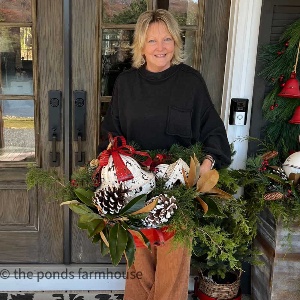 Rachel from Ponds Farmhouse decorating her front porch