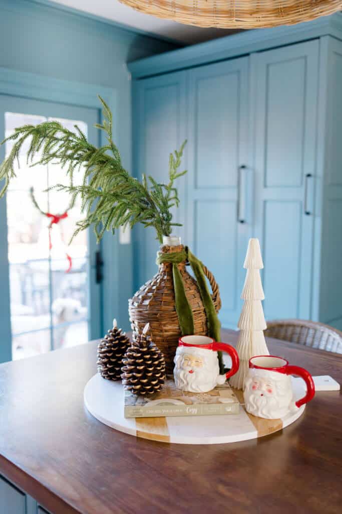 blue kitchen cabinets with 
Christmas decor on the island